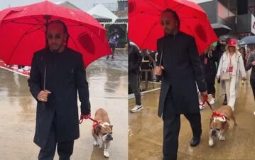 La imperial presentación de Lewis Hamilton en la Fórmula Uno en Gran Bretaña con su perro y abajo de la lluvia